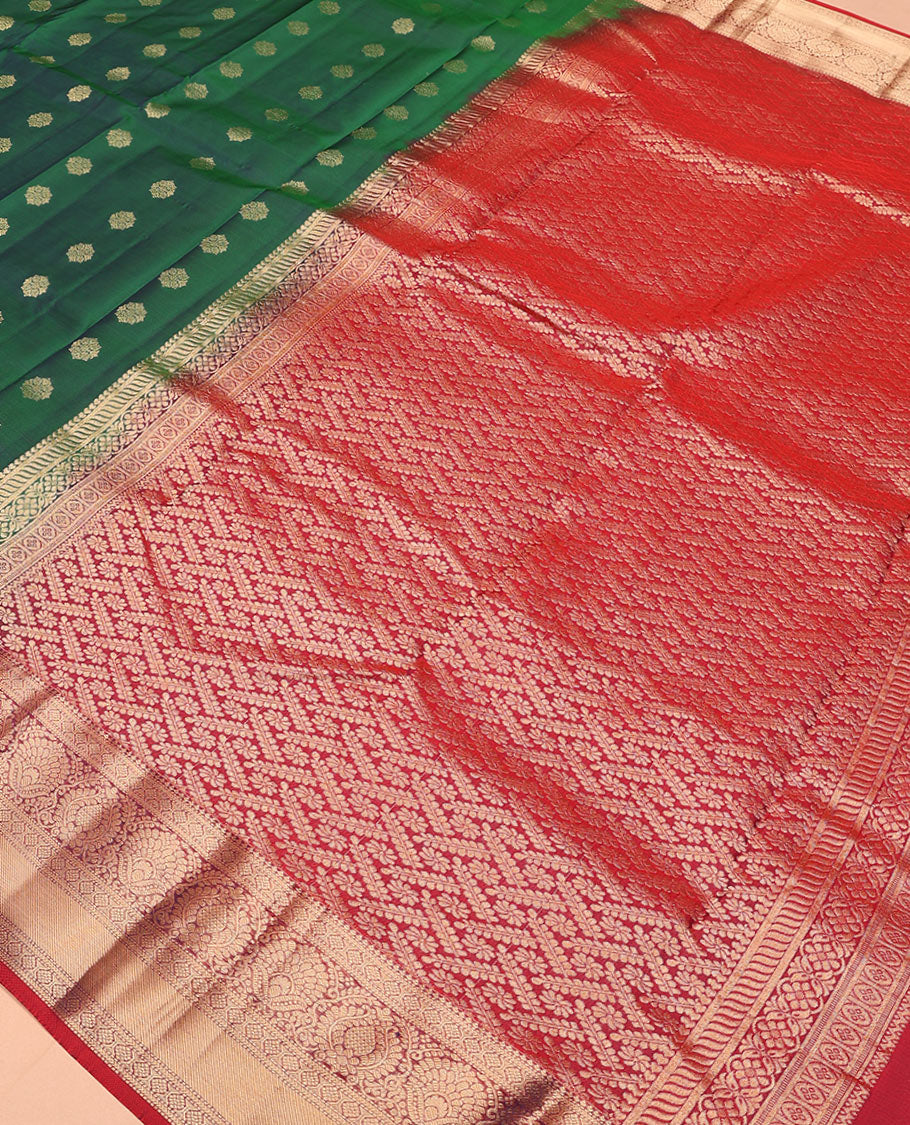 Green zari buttas Vasundhara silk mix saree, contrast border of thilakam, laddu kamalam, muthu, and kathir designs, and pallu of floral designs