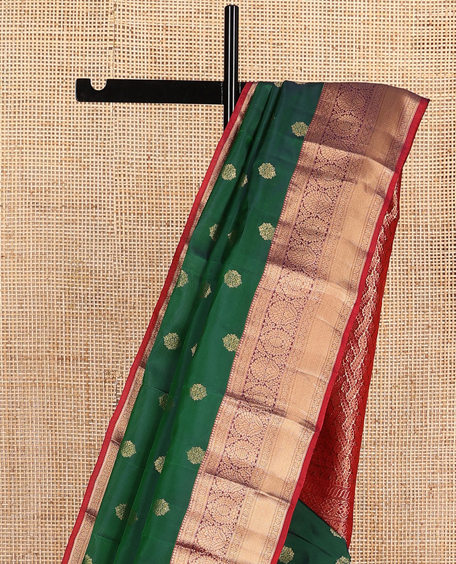 Green zari buttas Vasundhara silk mix saree, contrast border of thilakam, laddu kamalam, muthu, and kathir designs, and pallu of floral designs