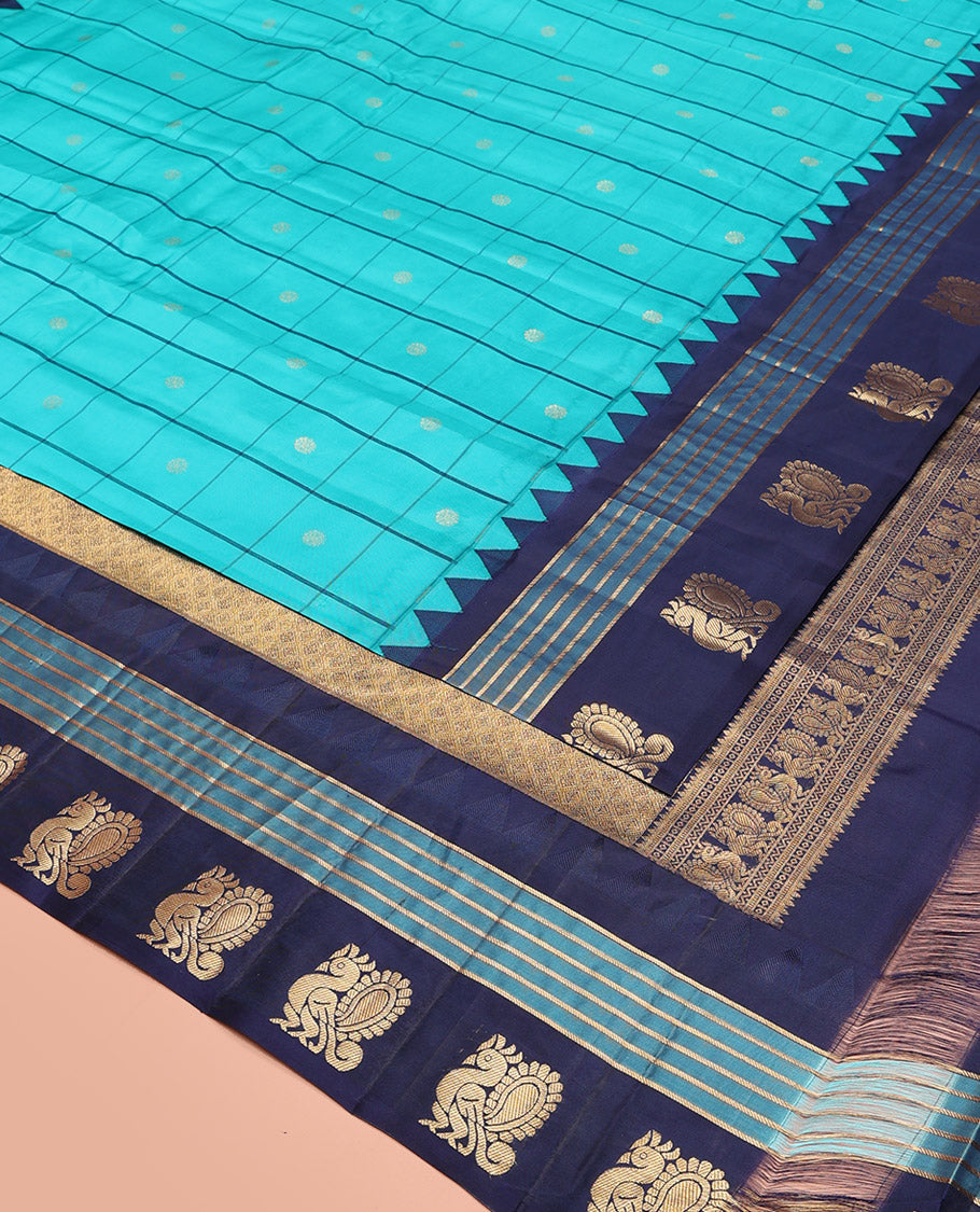 Blue Vasundhara Silk Saree, Mesmerized with Zari Butta Enclosed Checked Design on Its Body, Highlighted by a Contrast Border of Thazampoo Rekku, Banaras, and Mayil Designs, Scintillating Pallu of Jaal Design, and Paired with a Contrast Blouse