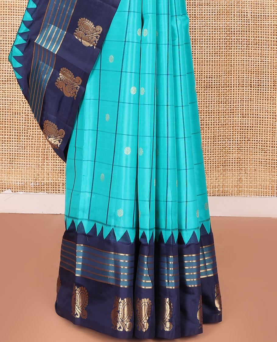 Blue Vasundhara Silk Saree, Mesmerized with Zari Butta Enclosed Checked Design on Its Body, Highlighted by a Contrast Border of Thazampoo Rekku, Banaras, and Mayil Designs, Scintillating Pallu of Jaal Design, and Paired with a Contrast Blouse