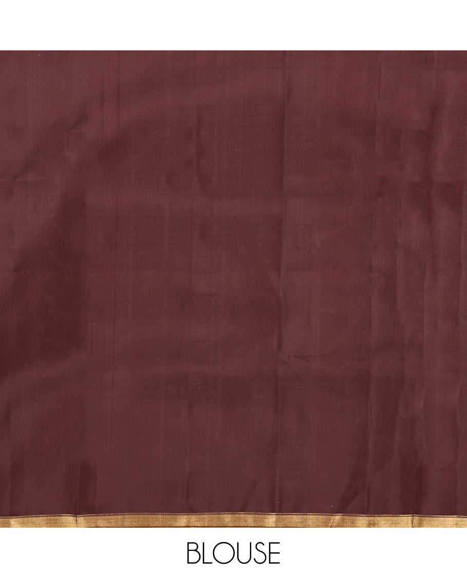 Brown Mayuri Soft Silk Saree, Subtly Woven with Buttas All Over Its Body, a Subtle Zari Piping Border, Pallu Steeped with Buttas, and Paired with a Matching Blouse