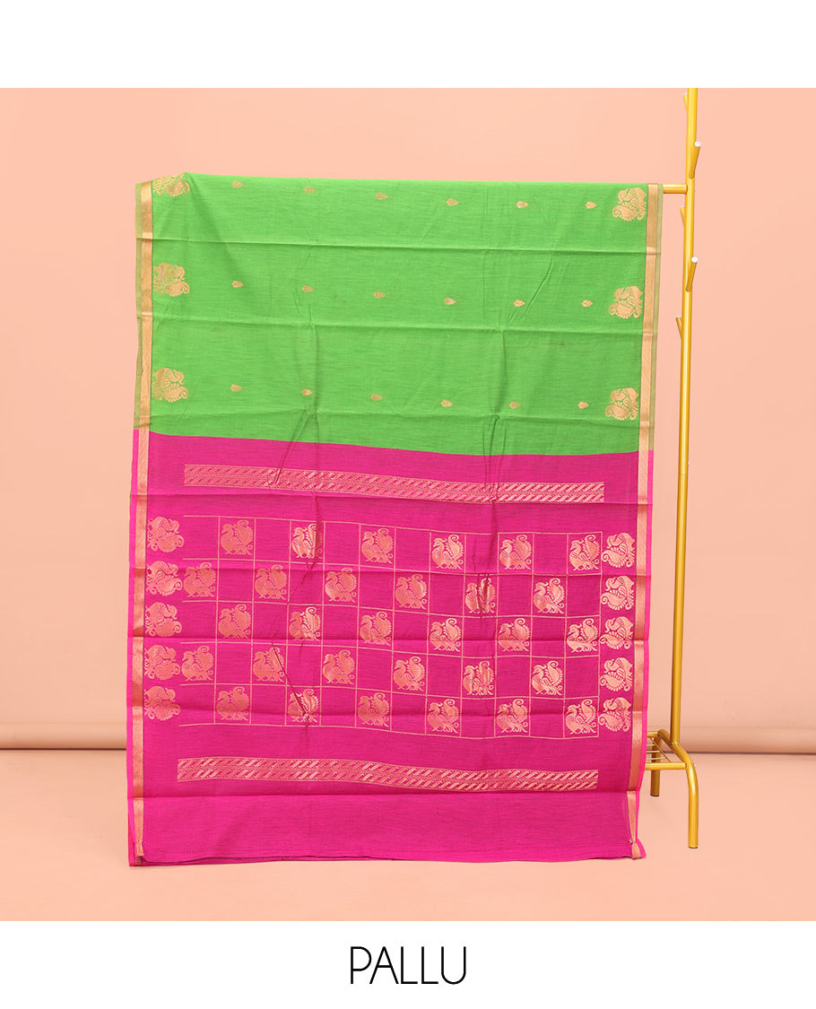 Parrot Green Semi-Silk Cotton Saree, Elegantly Framed with Zari Buttas All Over Its Body, a Subtle Zari Piping Border, Complemented by Contrast Pallu of Peacock Butta Enclosed Checked Design, and Paired with a Contrast Blouse