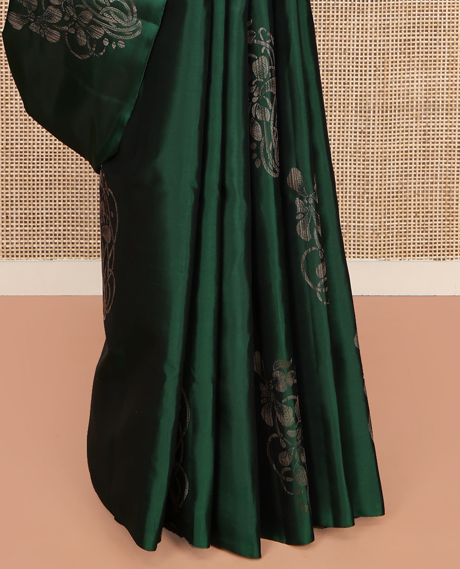 Borderless Green Mayuri Soft Silk Saree, Elevated with Buttas All Over Its Body, a Sparsely Sparkled Self-Pallu, and Paired with a Matching Blouse