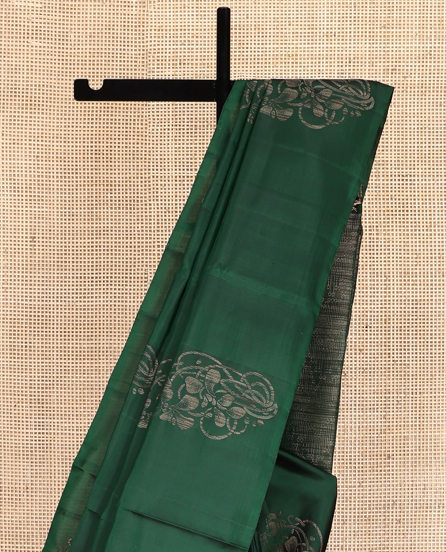 Borderless Green Mayuri Soft Silk Saree, Elevated with Buttas All Over Its Body, a Sparsely Sparkled Self-Pallu, and Paired with a Matching Blouse