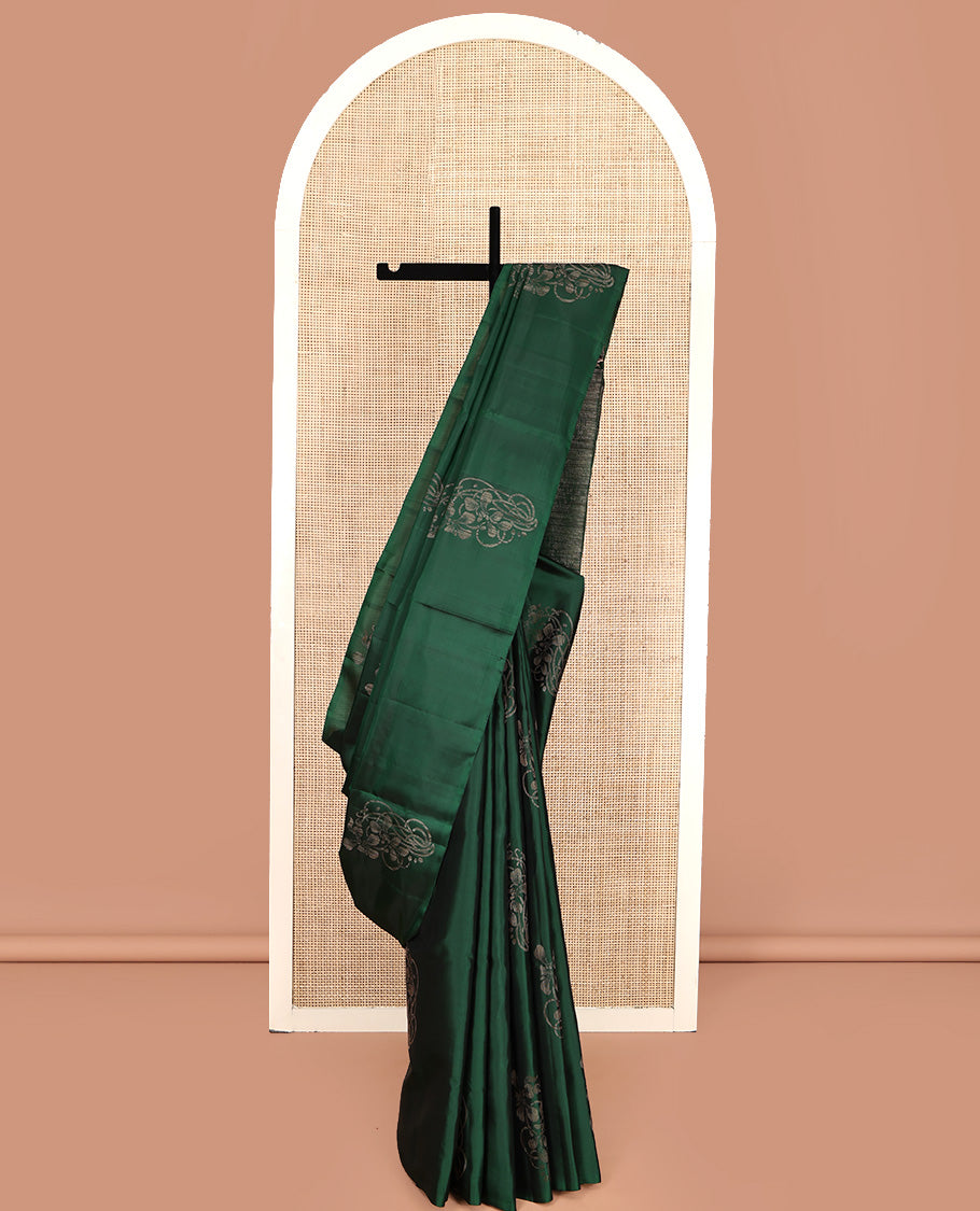 Borderless Green Mayuri Soft Silk Saree, Elevated with Buttas All Over Its Body, a Sparsely Sparkled Self-Pallu, and Paired with a Matching Blouse