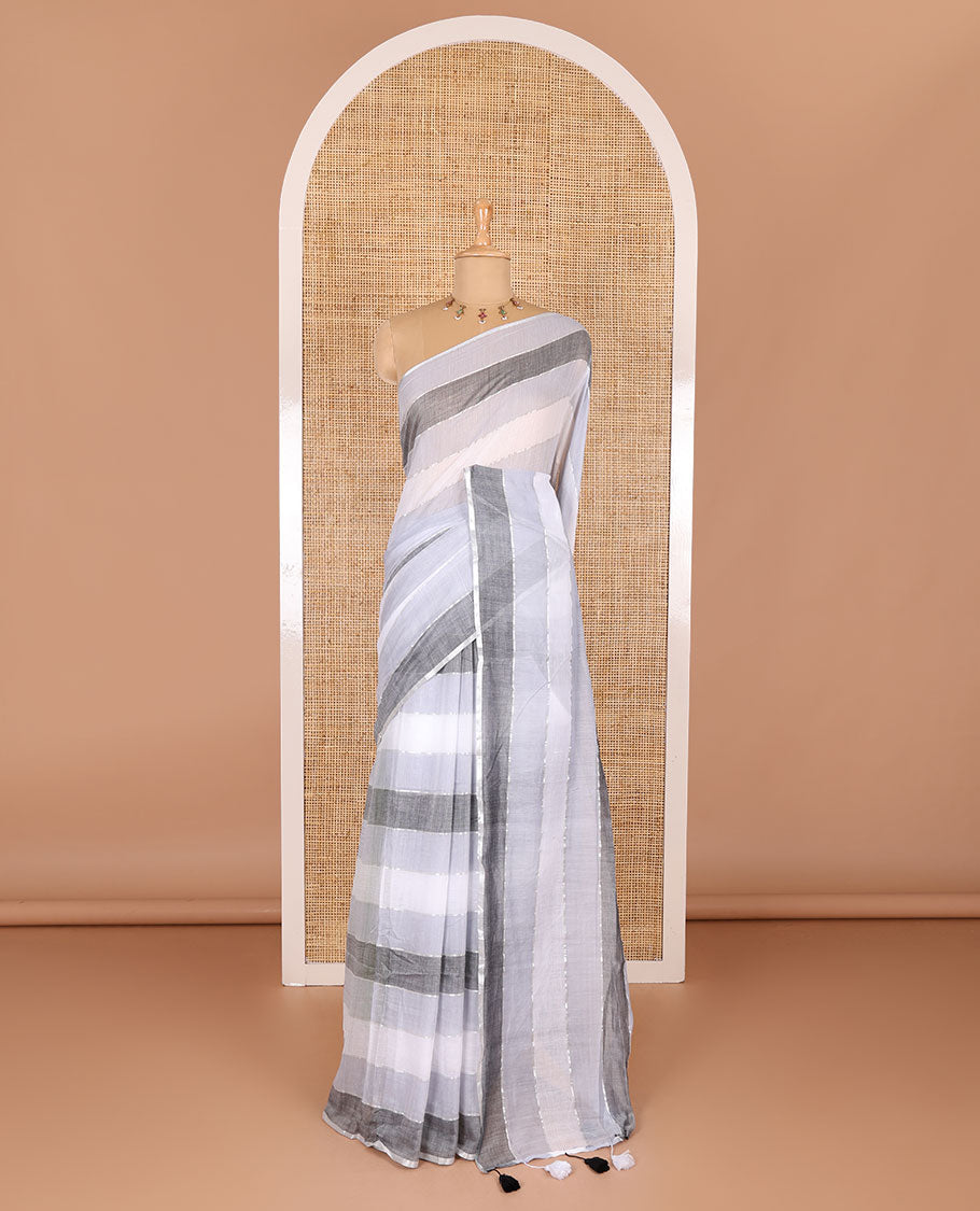 Grey ombre-colored striped khadi mul cotton saree, zari piping border, striped pallu, and a matching striped blouse