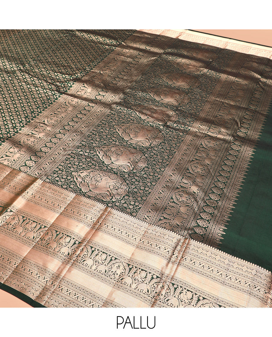 Green Kanchipuram Silk Saree Spotlighted with Jacquard Design, Highlighted by Zari Border of Thilakam, Diamond, Chakram, Cross Kamalam, Mayil, Yaanai, and Zari Designs, Pallu Pictures Big Yaali Designs, and Paired with a Matching Blouse