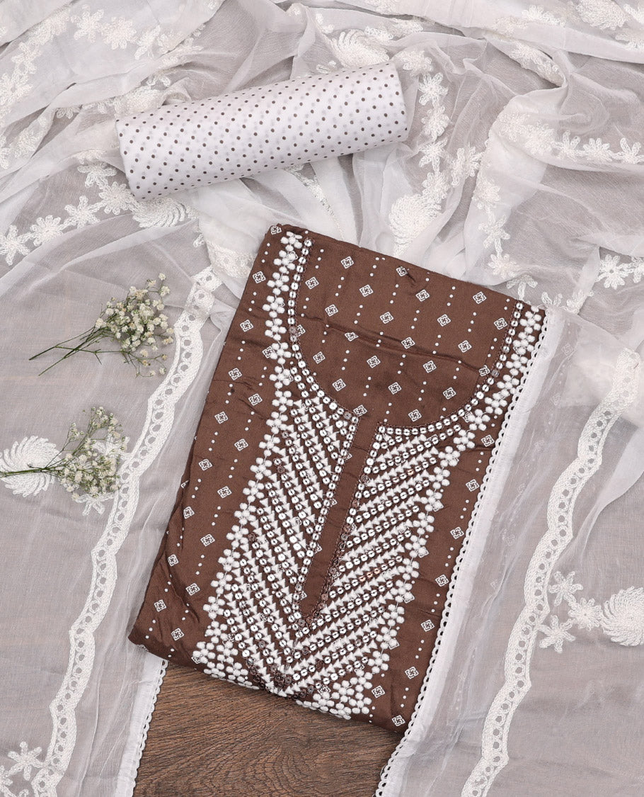 Brown Material Chudidar Set, Adorned with Geometric Print and Neck Embroidery on Rayon Top, a Contrast Polka Dot Printed Bottom, and Paired with Embroidered Chiffon Dupatta
