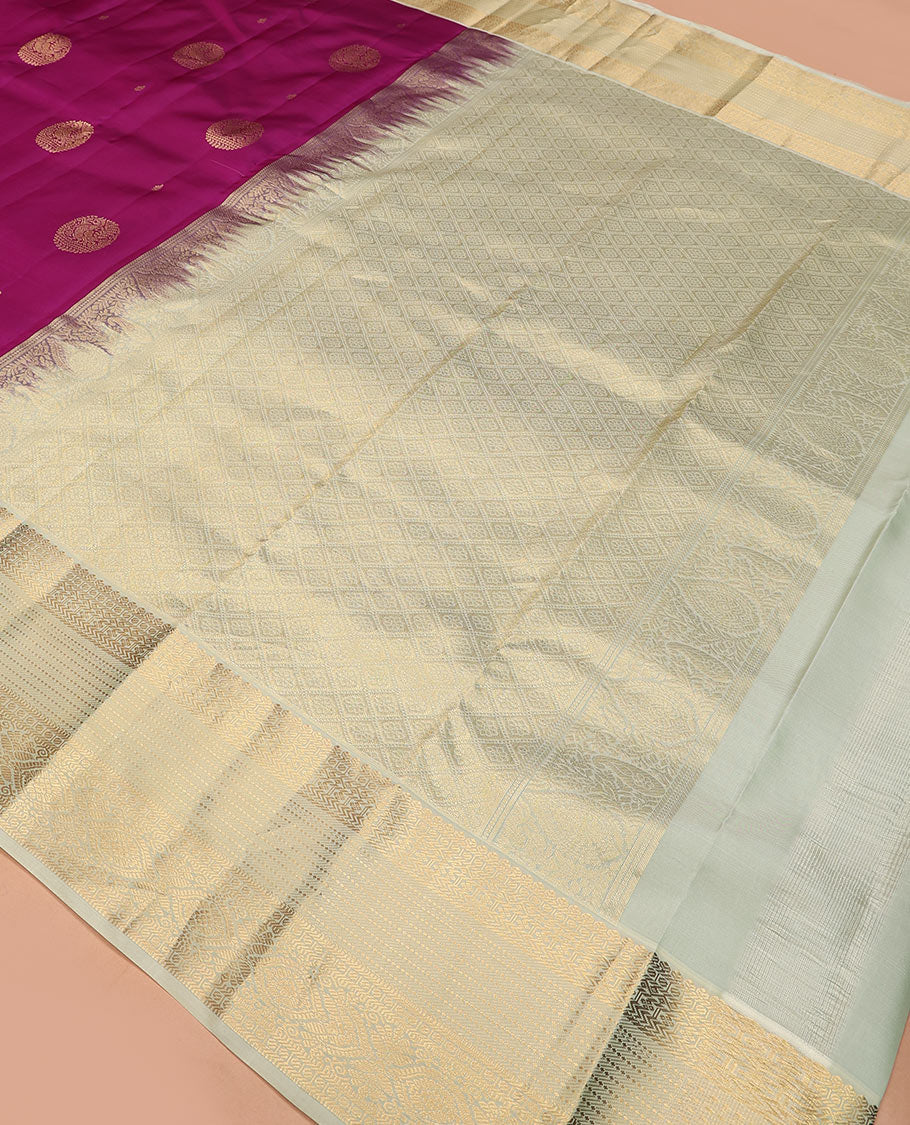 Purple round mayil buttas Vasundhara silk mix saree, contrast border of thilakam mokku, paisa, banaras, diamond, vanki, banaras, muthu, and chakra designs, and jaal pallu