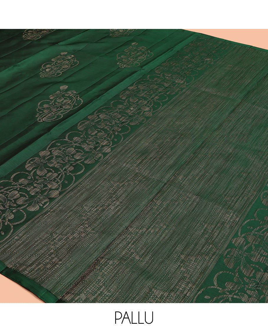 Borderless Green Mayuri Soft Silk Saree, Elevated with Buttas All Over Its Body, a Sparsely Sparkled Self-Pallu, and Paired with a Matching Blouse