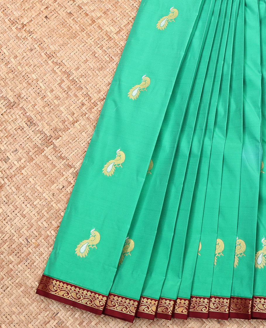 Green Budget Silk Saree, Mesmerized with Peacock Buttas, Complemented by a Contrast Paisley Vine Zari Border, Grand Pallu, and Contrast Blouse
