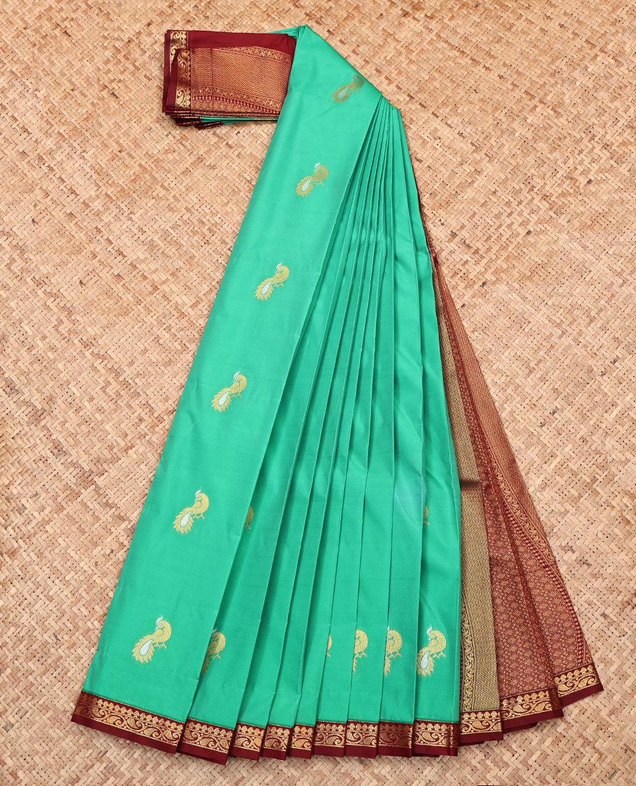 Green Budget Silk Saree, Mesmerized with Peacock Buttas, Complemented by a Contrast Paisley Vine Zari Border, Grand Pallu, and Contrast Blouse