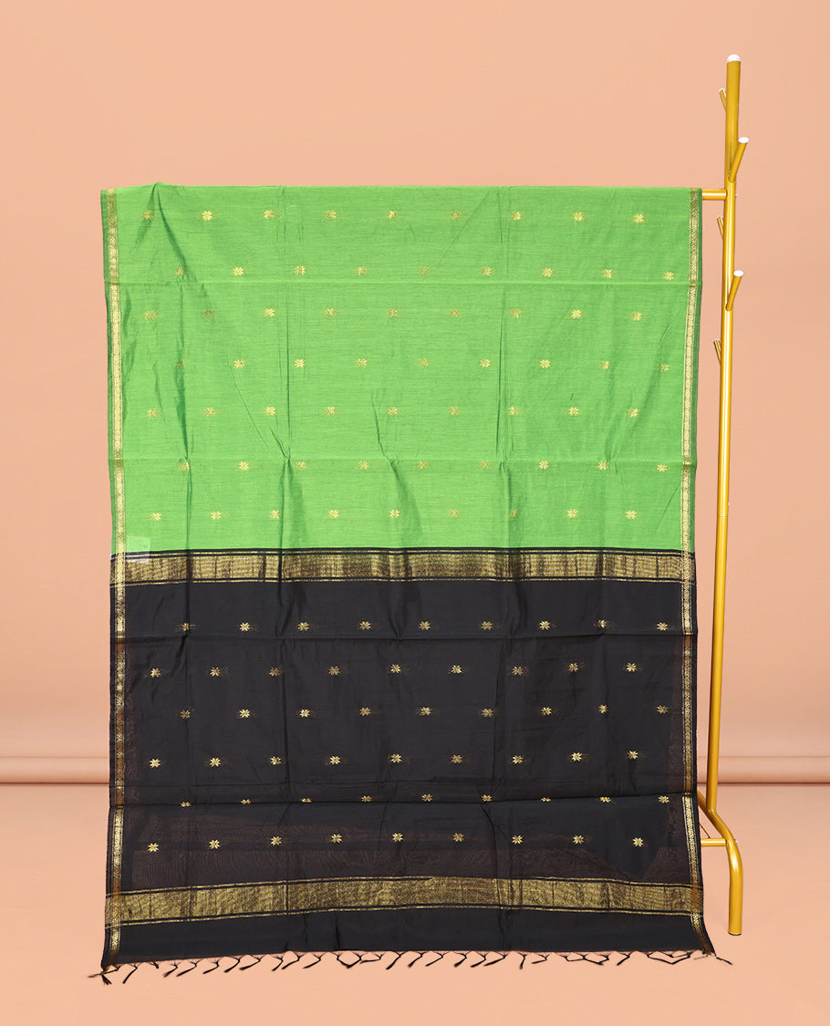 Leaf Green Maheshwari Cotton Saree, Prettified with Buttas All Over Its Body, Subtle Zari Piping Border, Complemented by a Contrast Pallu Steeped with Buttas, and Paired with a Contrast Blouse