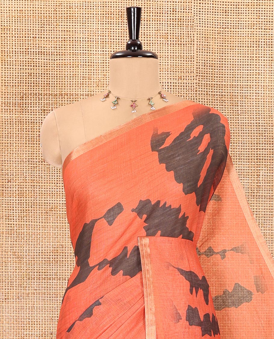 Orange shibori printed linen cotton saree, piping border, contrast floral printed pallu, and a contrast floral printed blouse