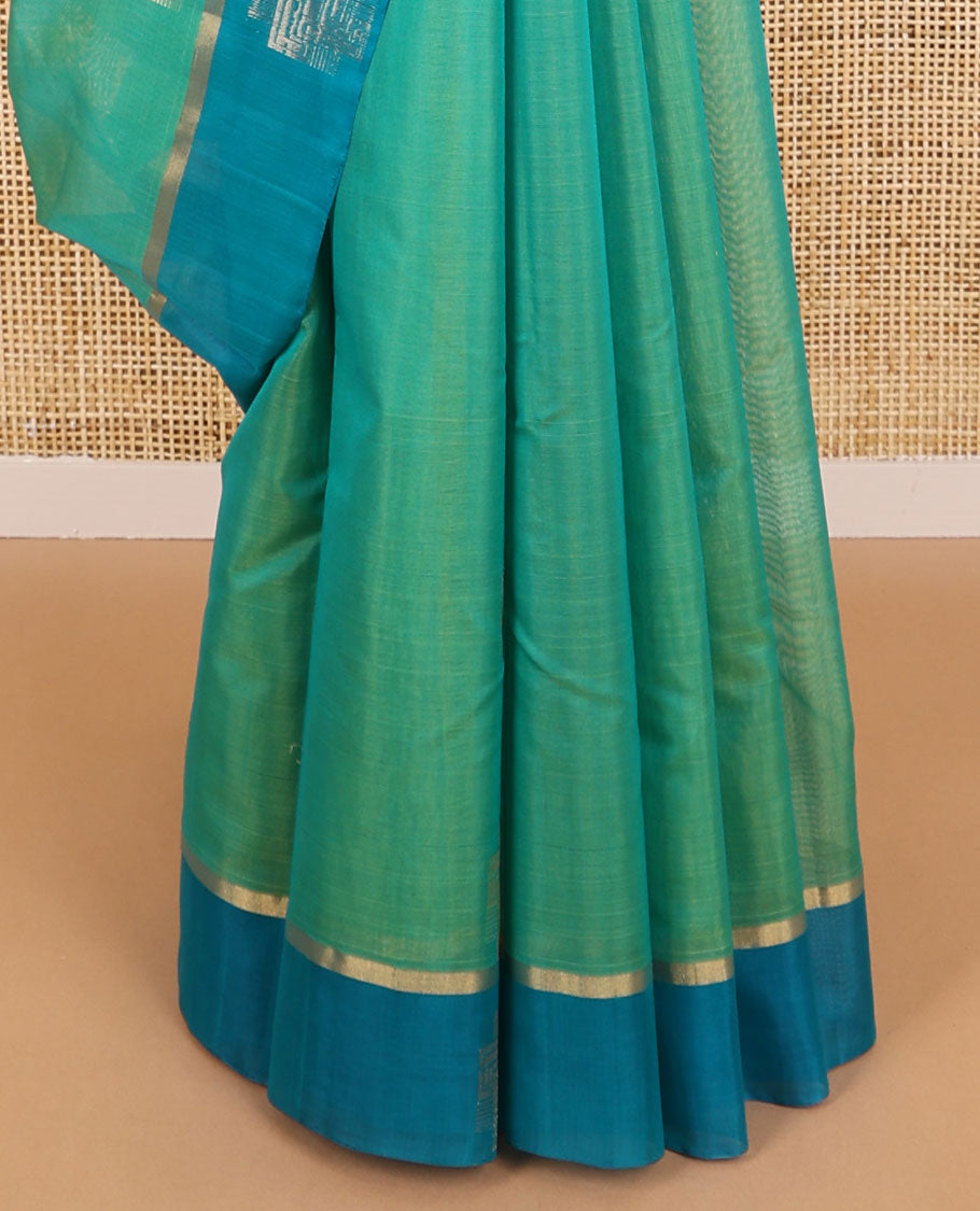 Sea green geometric design silk cotton saree with contrast zari design border & ogee design pallu