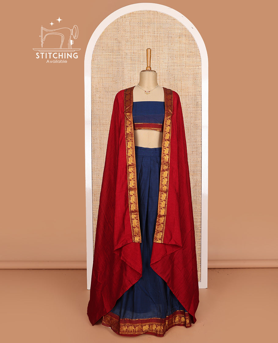 Blue cotton half-saree, plain with contrast elephant motif bordered skirt, matching blouse, and contrast elephant motif bordered dhavani