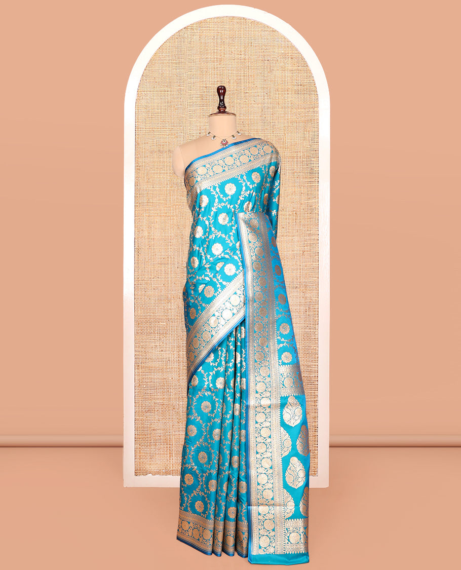 Blue Banarasi Nylon Saree, Highlighted by Floral Jacquard, Floral Creeper Zari Border, Intricate Pallu, and a Matching Blouse