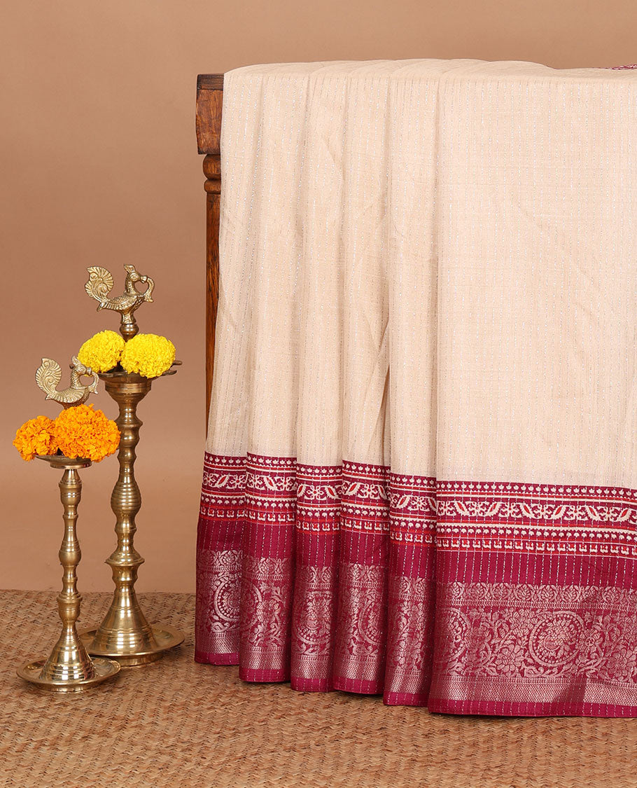 Cream vertical zari striped dola silk saree,contrast maroon traditional zari border & intricately Ajrakh printed pallu