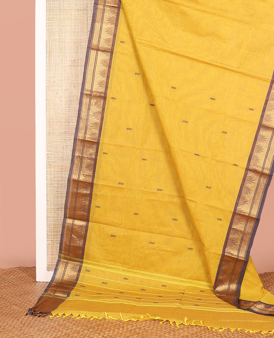 Yellow Chettinad Cotton Saree Subtly Made with Thread Buttas All Over Its Body, Complemented by a Contrast Traditional Zari Temple Border, and a Pallu of Stripes and Buttas