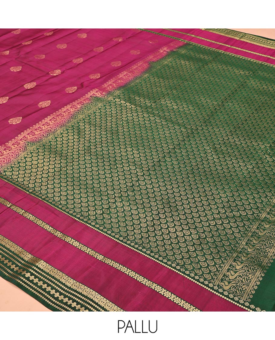 Maroon Vasundhara Lite Silk Mix Saree, Decked Up with Zari Buttas All Over Its Body, Complemented by Contrast Varisai Pettu Zari Border, Grandly Decked Up Pallu, and Paired with a Contrast Blouse