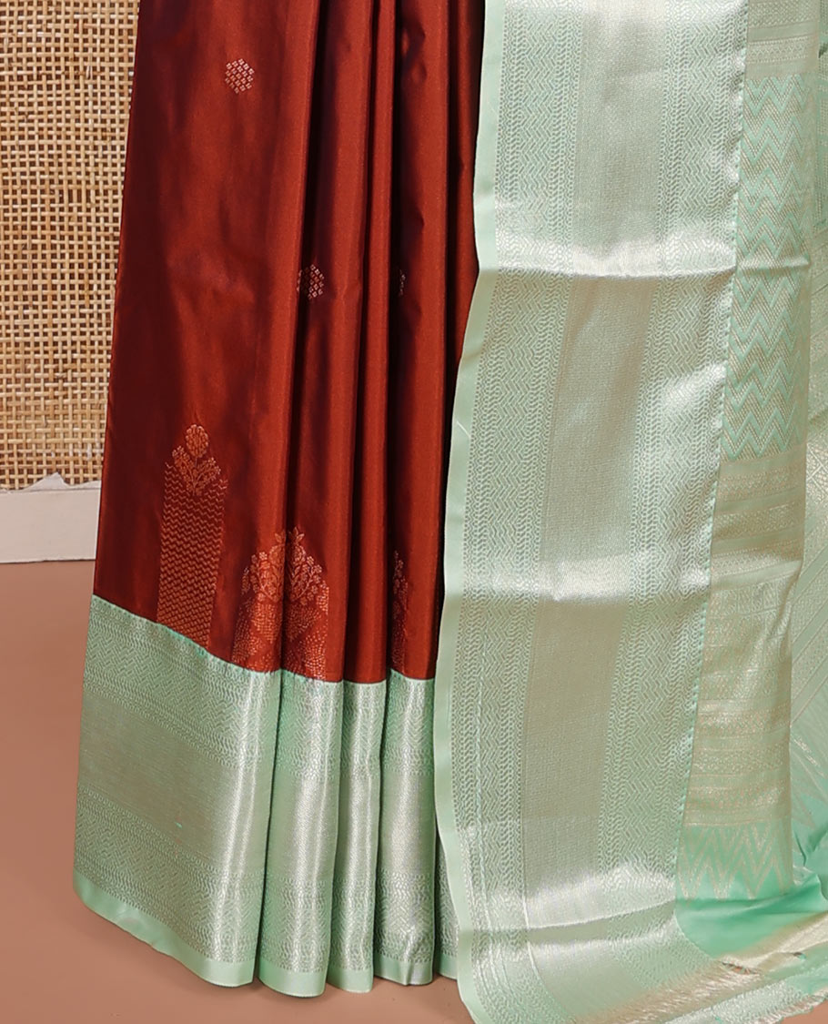 Rust Budget Silk Saree, Elevated with Zari Buttas on Its Body, Complemented by a Contrast Traditional Zari Design Border, Chevron Design Pallu, and Paired with a Contrast Blouse