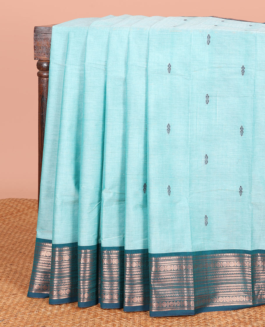Blue Chettinad Cotton Saree Subtly Adorned with Thread Buttas All Over Its Body, Complemented by a Contrast Traditional Zari Motifs Steeped Border, and a Pallu of Stripes and Buttas