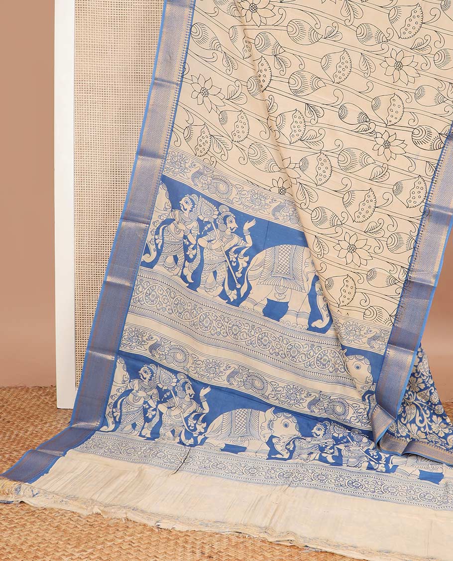 Light sandal lotus and fish motifs machine printed kalamkari cotton saree, contrast traditional zari blue border, and pallu of human and elephant motifs