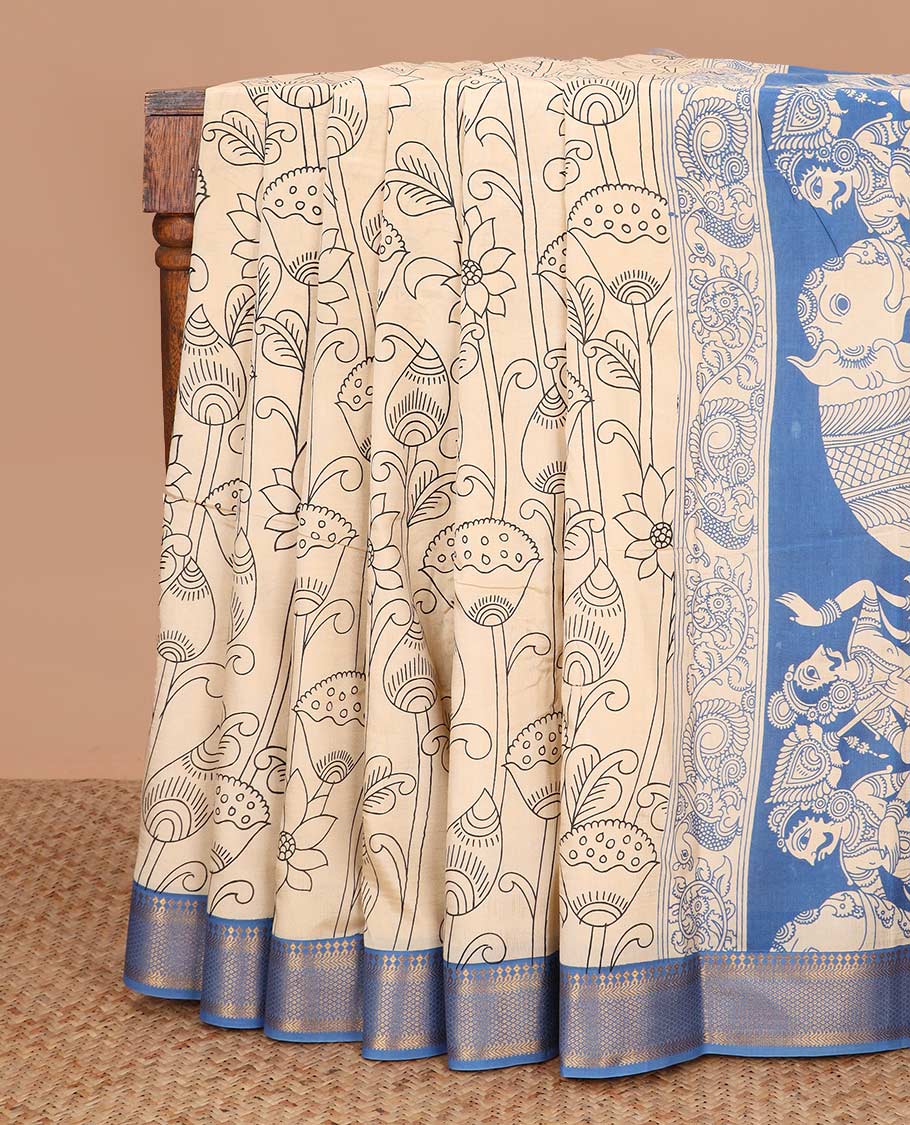 Light sandal lotus and fish motifs machine printed kalamkari cotton saree, contrast traditional zari blue border, and pallu of human and elephant motifs