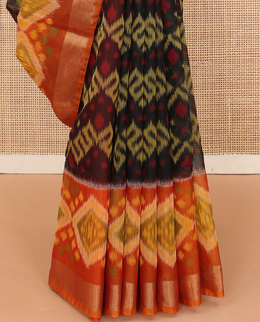 Black ikkat chevron design silk cotton saree, contrast diamond ikkat patterned border, and pallu of ikkat designs