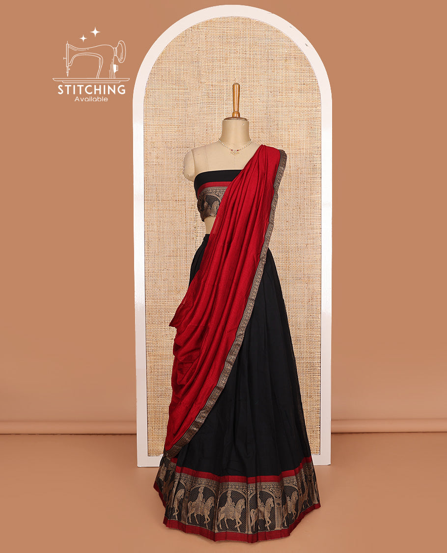 Black cotton half-saree, plain with contrast man on the horse motifs bordered skirt, matching blouse, and contrast dhavani