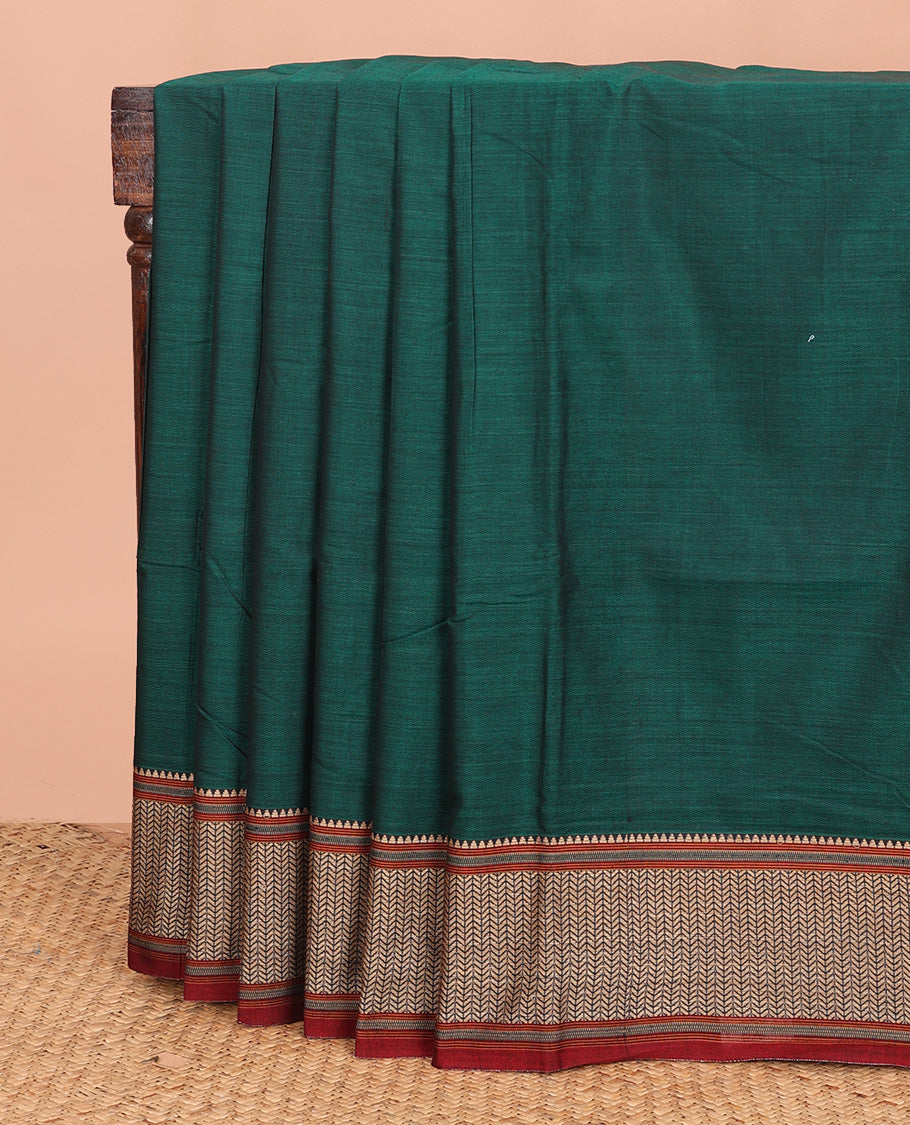 Dark green plain Narayanapet cotton saree, contrast geometric patterned thread border, and striped pallu