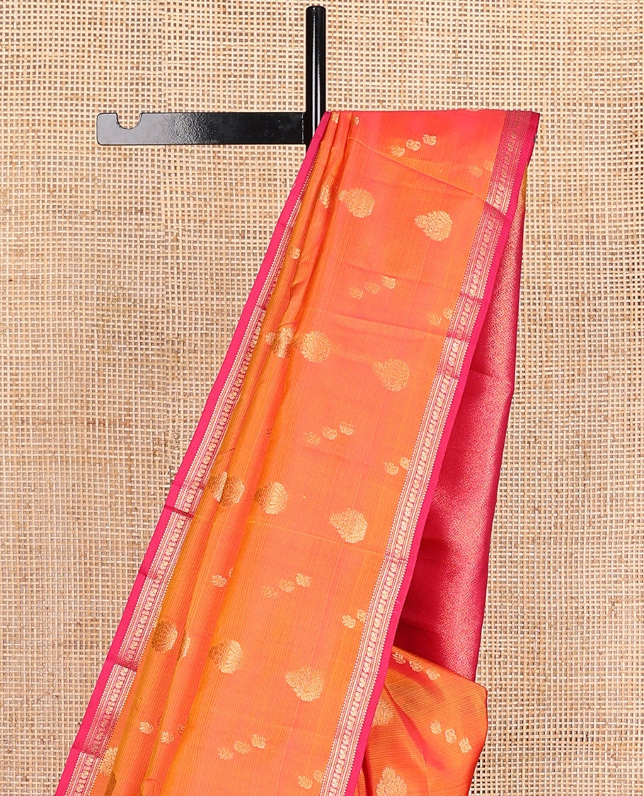 Orange stripes, and zari buttas Vasundhara silk mix saree, contrast border of rekku, kathir, and mayil designa, and zari-rich jaal pallu