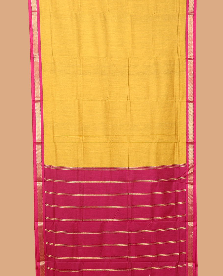 Yellow plain nine-yard cotton saree, contrast traditional zari border, and striped pallu