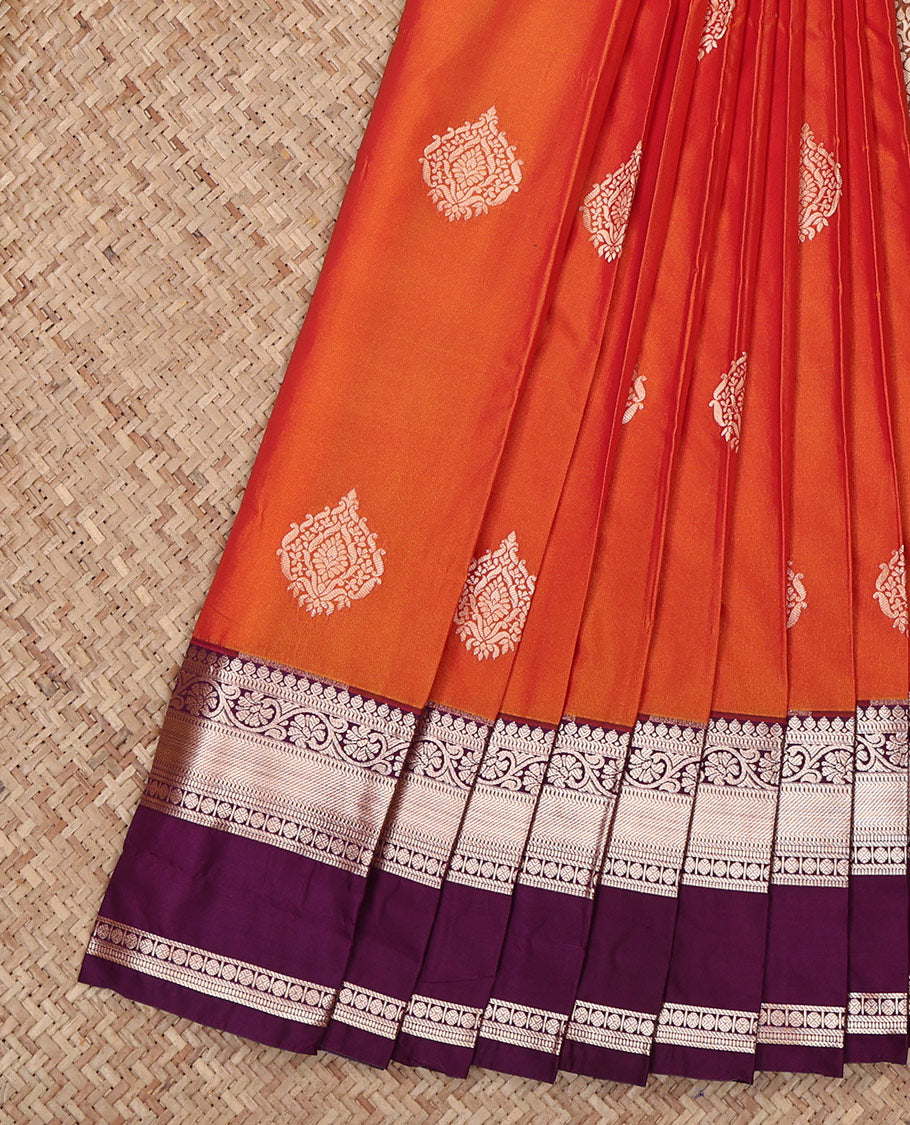 Orange Budget Silk Saree, Highlighted by Zari Buttas All Over Its Body, Complemented by a Contrast Traditional Zari Design Rettai Pettu Border, Intricately Designed Pallu, and Paired with a Contrast Blouse