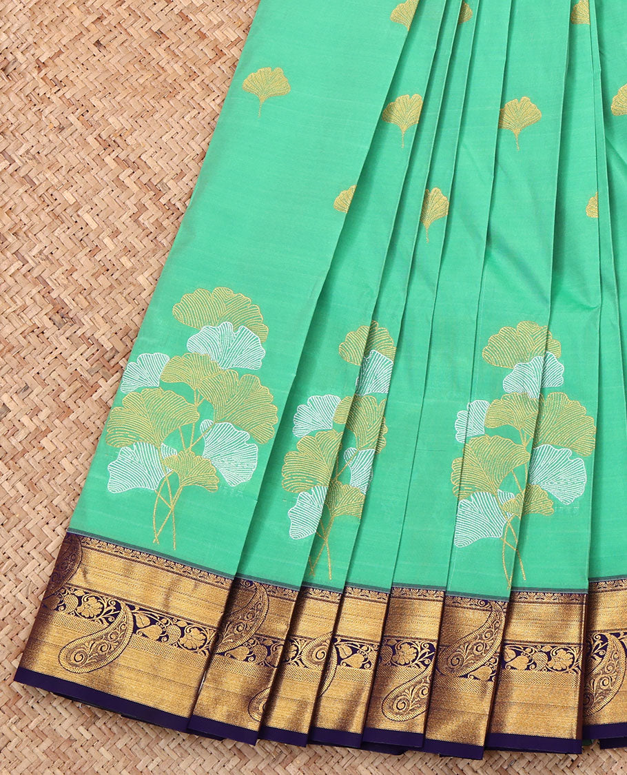 Green Budget Silk Saree, Meticulously Crafted with Leaf Buttas, Complemented by a Contrast Paisley Zari Border, Intricate Pallu, and Contrast Blouse