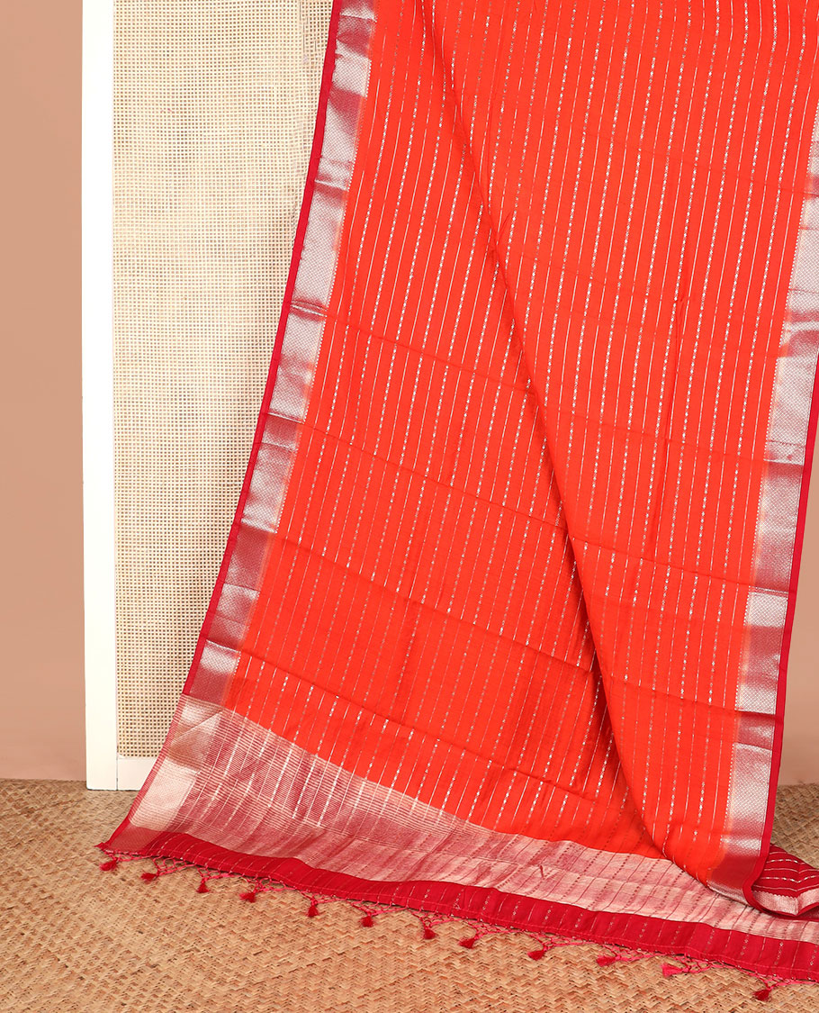 Orange zari striped assam silk saree, contrast traditional zari border, and zari striped pallu