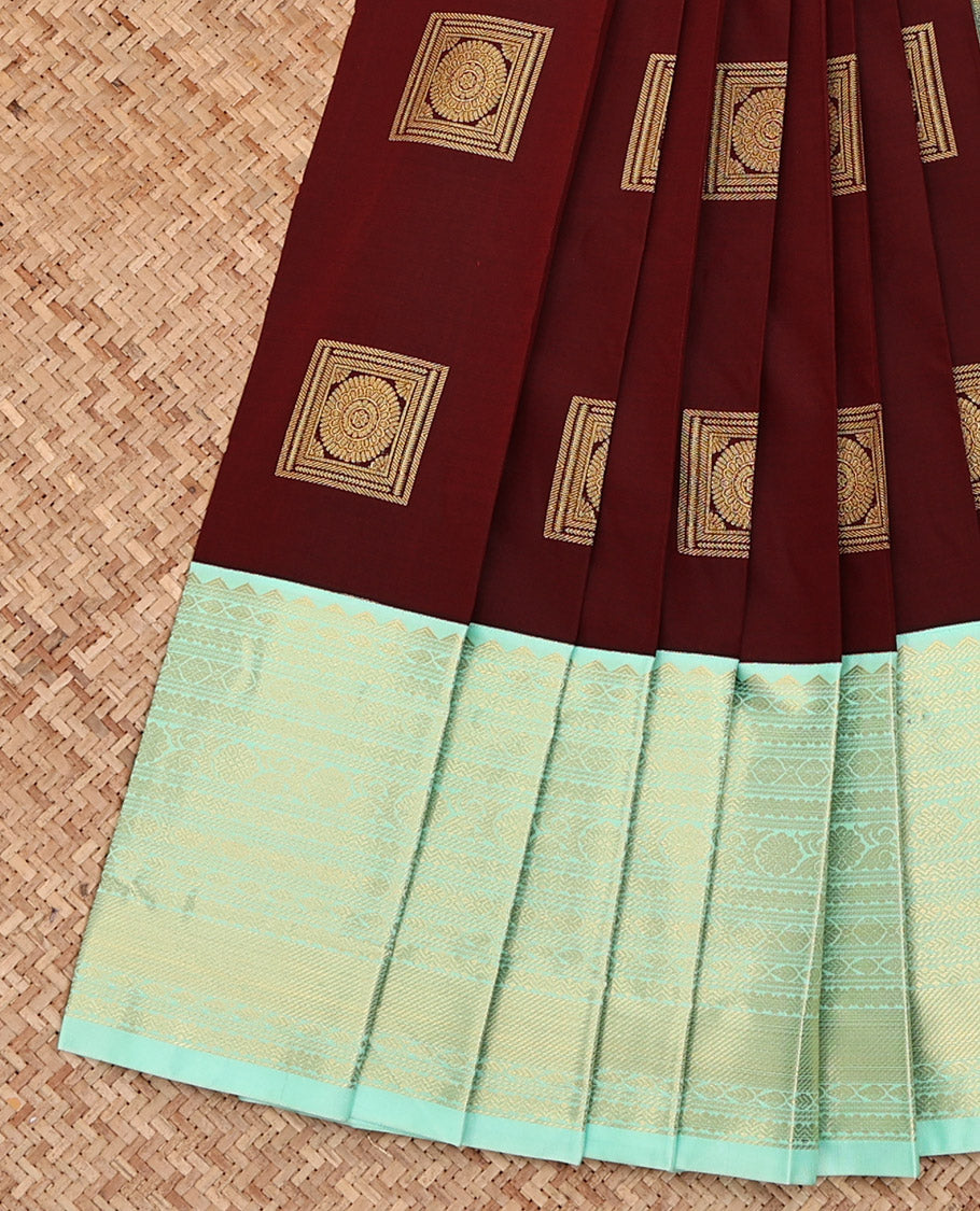 Maroon Budget Silk Saree, Mesmerized with Square-Shaped Zari Buttas All Over Its Body, Complemented by a Contrast Traditional Zari Design Border, Gleaming Jaal Pallu, and Paired with a Contrast Blouse