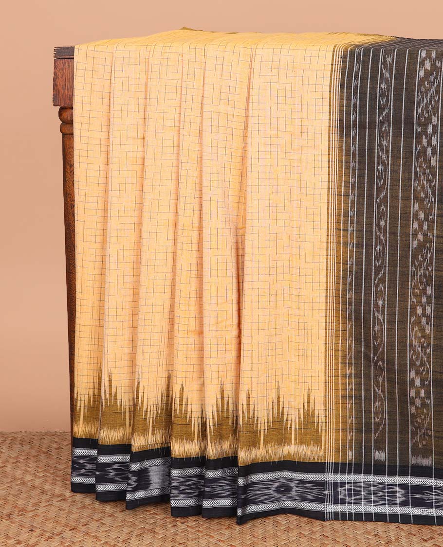 Yellow geometric maze style ikkat cotton saree, contrast black ikkat border, and pallu of ikkat weave