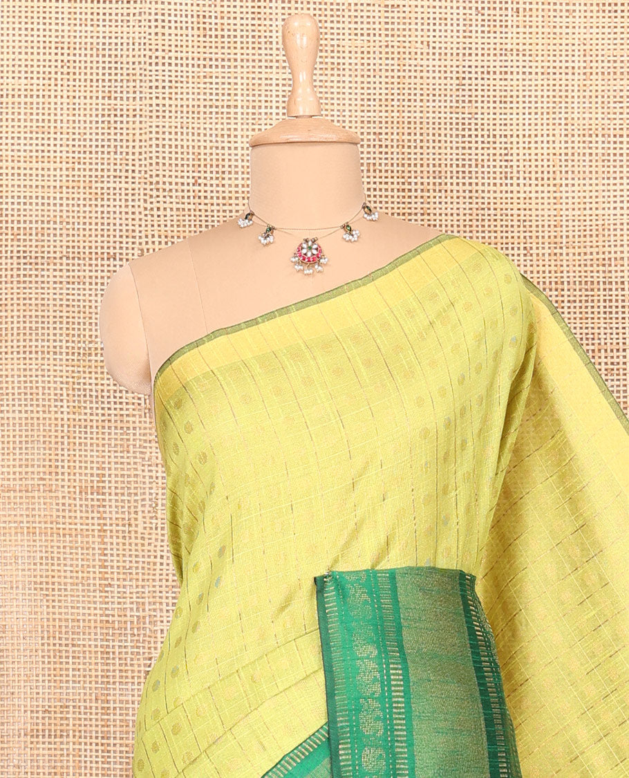 Parrot green polka dot butta enclosed checked semi-raw silk saree, contrast traditional zari design border, contrast diamond patterned pallu, and a contrast blouse