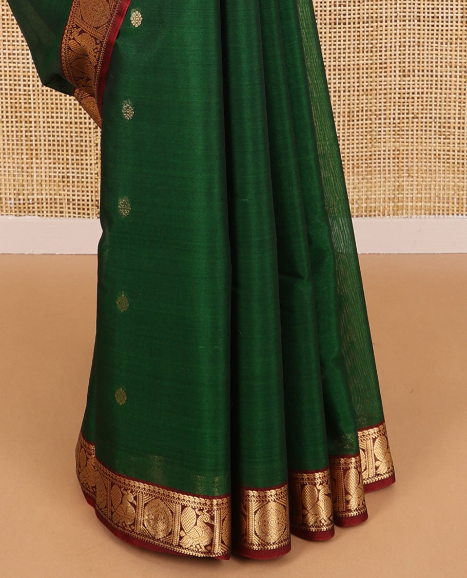 Dark green motifs silk cotton saree with intricate zari design border & floral design pallu