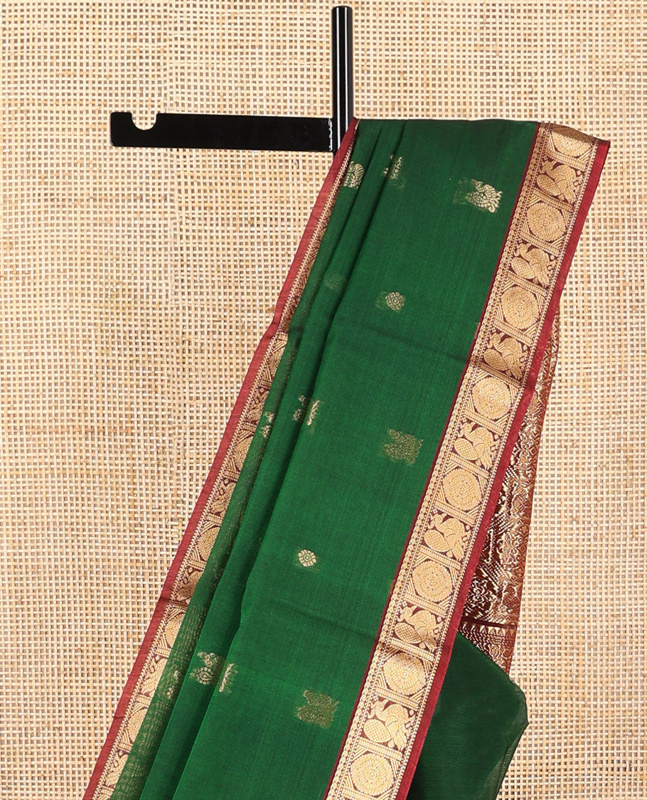 Dark green motifs silk cotton saree with intricate zari design border & floral design pallu