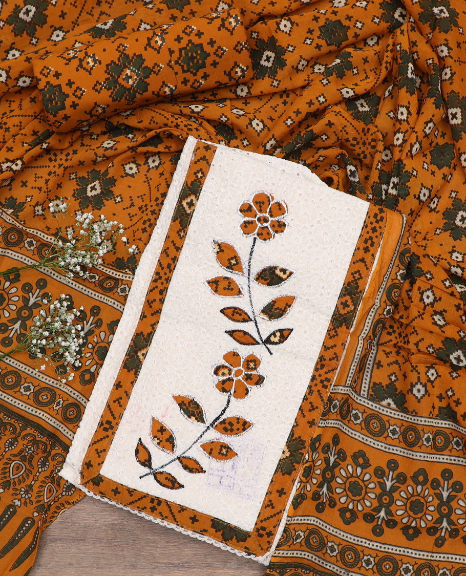 White material chudidar set, cut work with neck patch embroidered top, contrast patola printed bottom, and dupatta of patola print