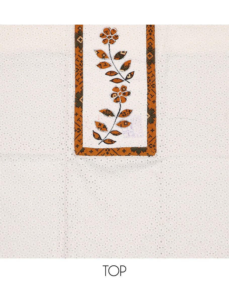 White material chudidar set, cut work with neck patch embroidered top, contrast patola printed bottom, and dupatta of patola print
