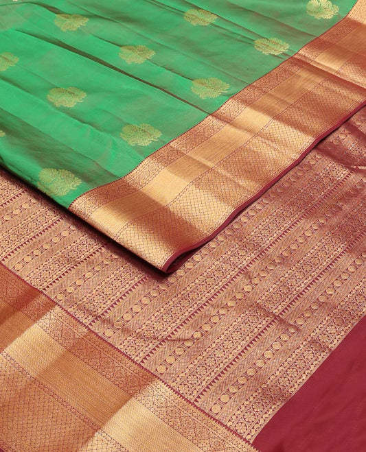 Green zari buttas Vasundhara silk mix saree, contrast border of rekku,diamond & jaal designs & pallu of rekku,rudraksham,manga & kodi visiry