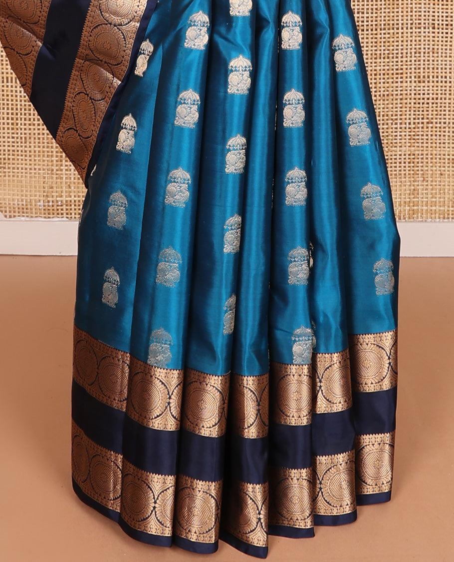 Blue zari buttas Vasundhara silk mix saree, contrast rettai pettu border of rekku, poun, and chakram motifs, and jaal pallu