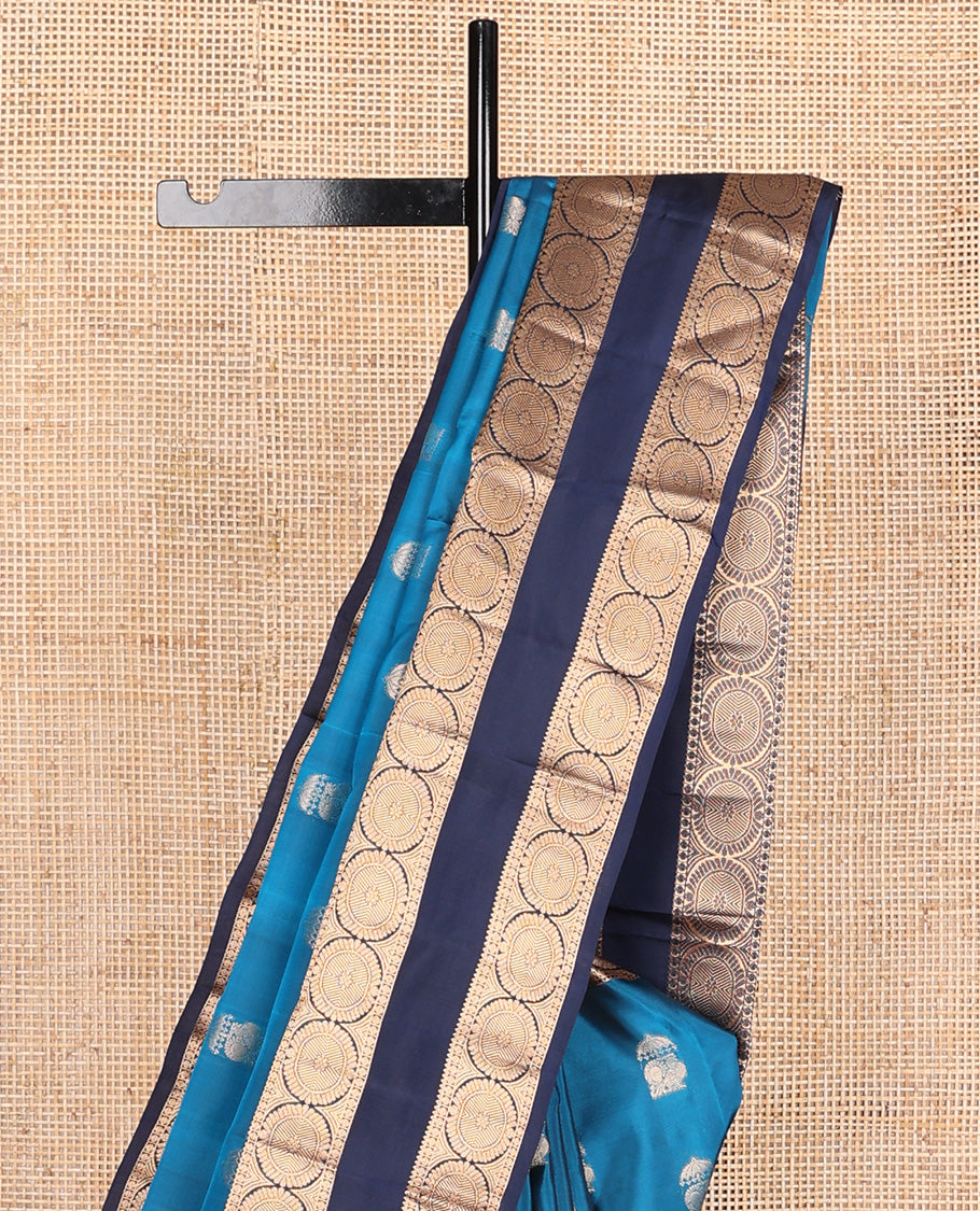 Blue zari buttas Vasundhara silk mix saree, contrast rettai pettu border of rekku, poun, and chakram motifs, and jaal pallu