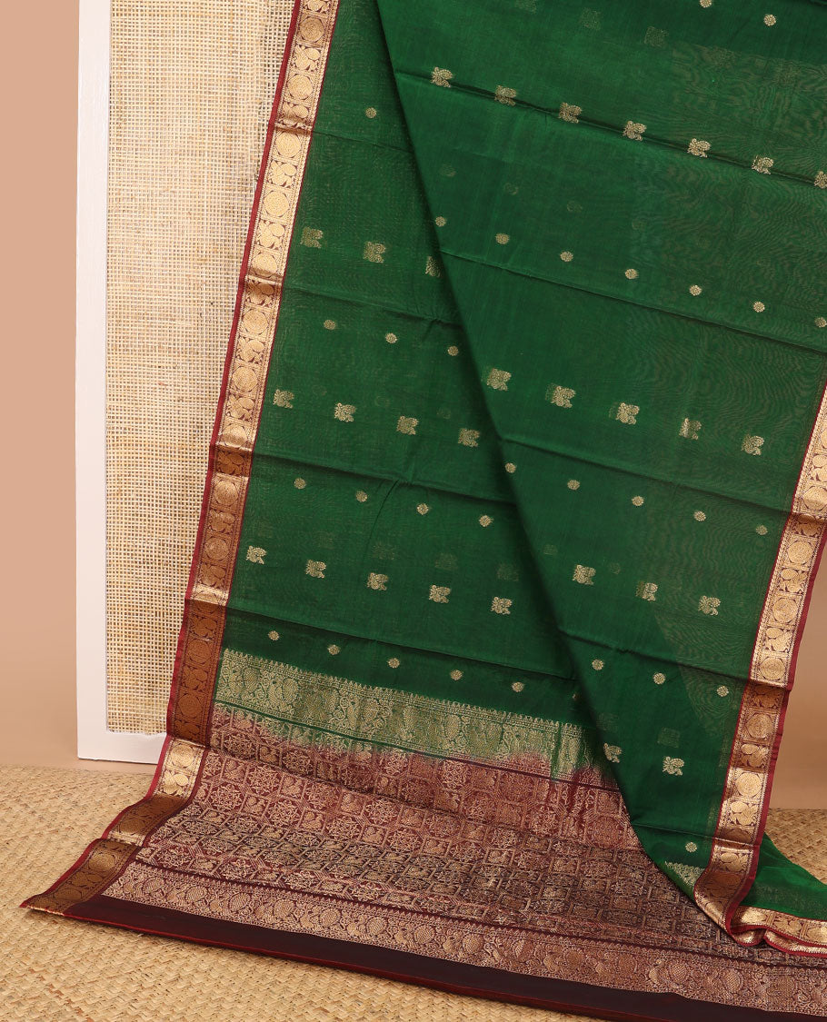 Dark green motifs silk cotton saree with intricate zari design border & floral design pallu