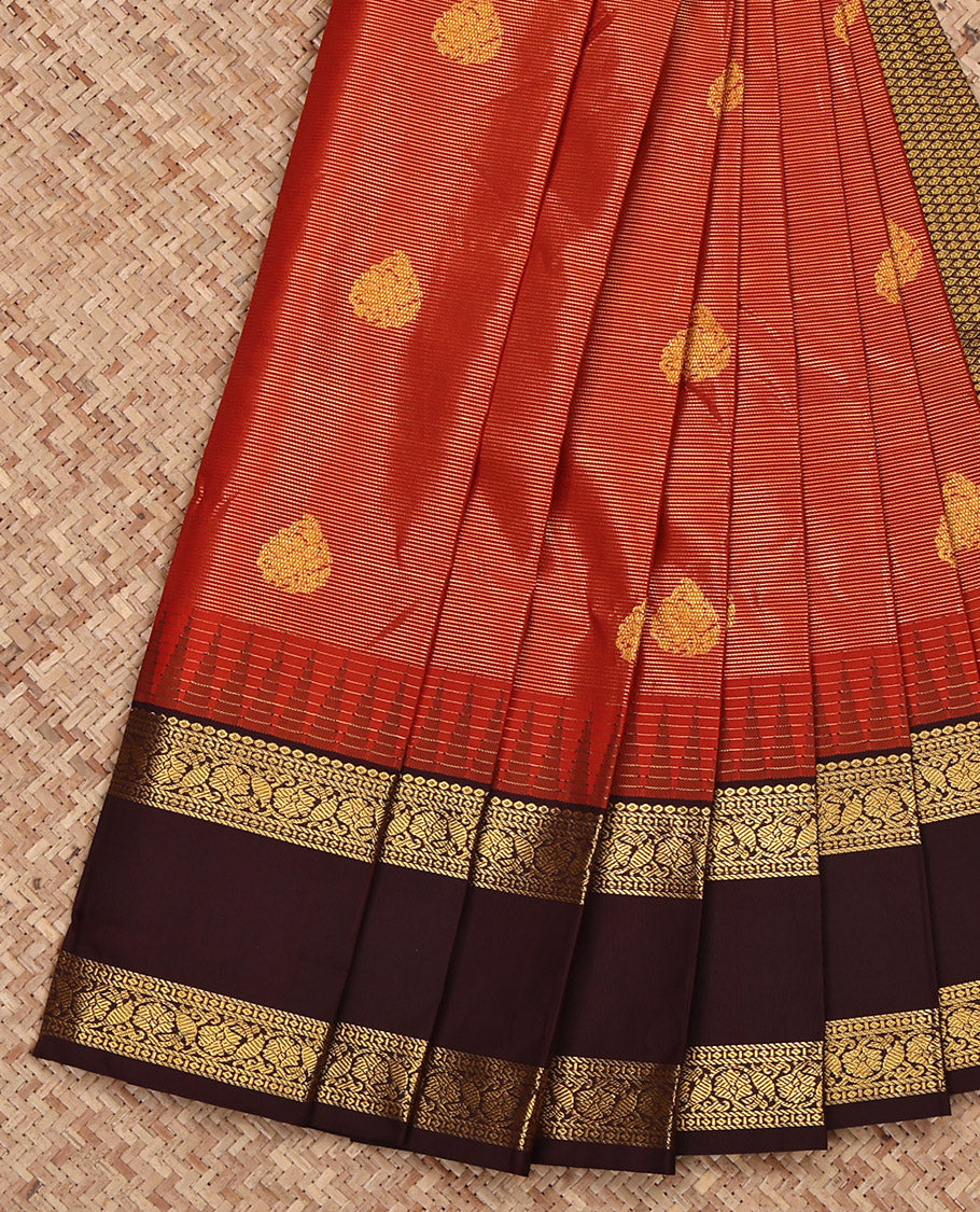 Rust Budget Silk Saree, Boldly Accentuated with Zari Buttas and Stripes on Its Body, Complemented by a Contrast Traditional Zari Design Rettai Pettu Temple Border, Grand Jaal Pallu, and Paired with a Contrast Blouse