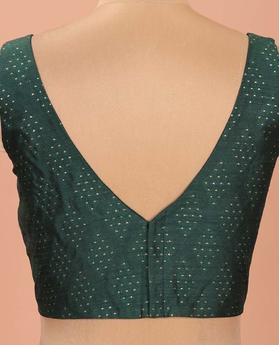Green Readymade Blouse Steeped with Dobby-Style Buttas, Featuring a Front Leaf-Neck, Back Deep Leaf-Neck, and Sleeveless Hand