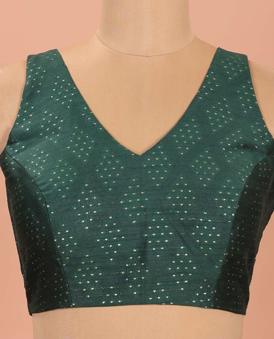 Green Readymade Blouse Steeped with Dobby-Style Buttas, Featuring a Front Leaf-Neck, Back Deep Leaf-Neck, and Sleeveless Hand